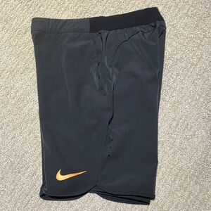 Nike Black Athletic Dri-Fit Shorts with Orange Swoosh